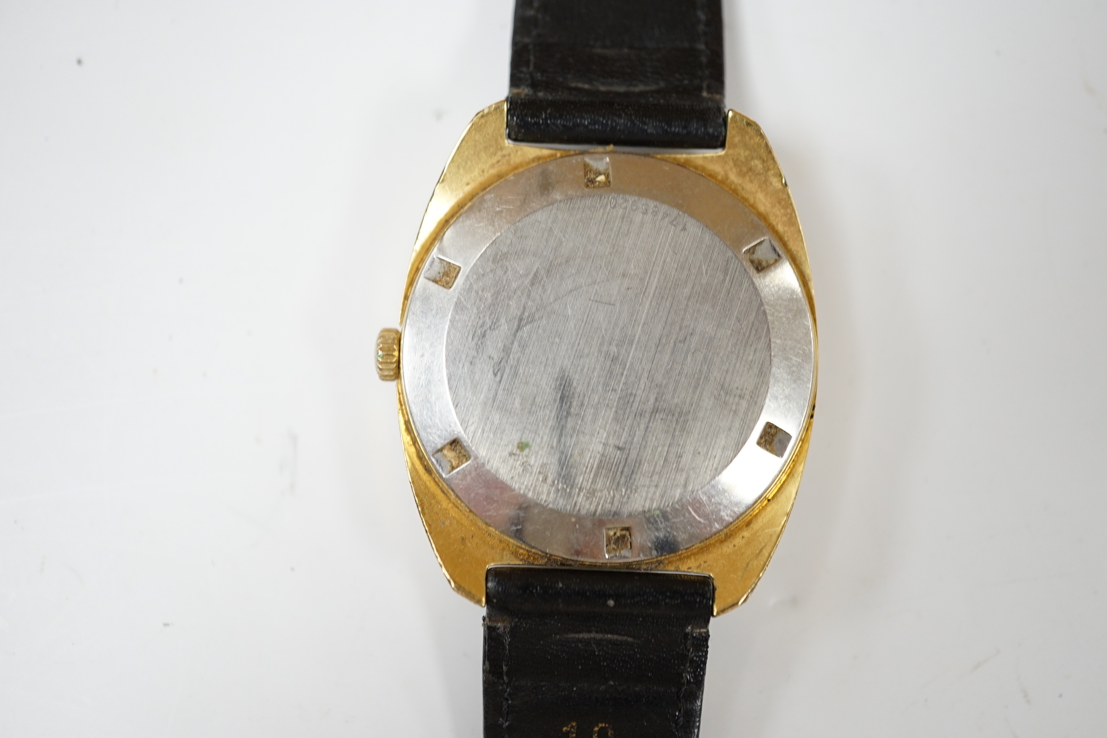 A gentleman's steel and gold plated Longines Conquest automatic wrist watch, with date aperture, on associated leather strap, case diameter 34mm.